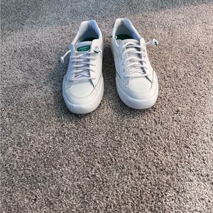 Sperry Women's White Sneakers with Green detailing.